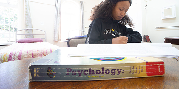 student reading and psychology book